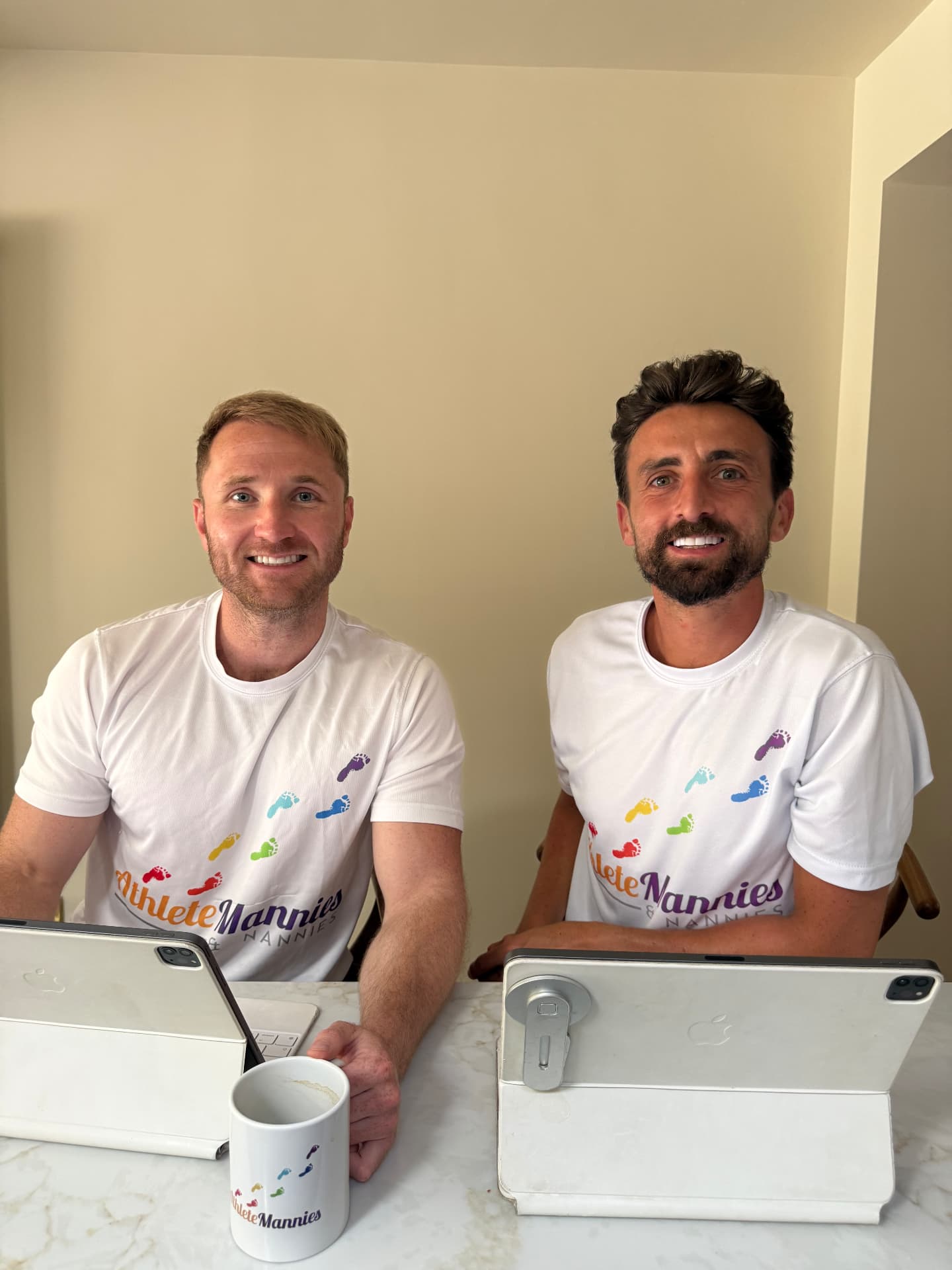 Richard Goodman and the Athlete Mannies & Nannies founding team at a table with tablets